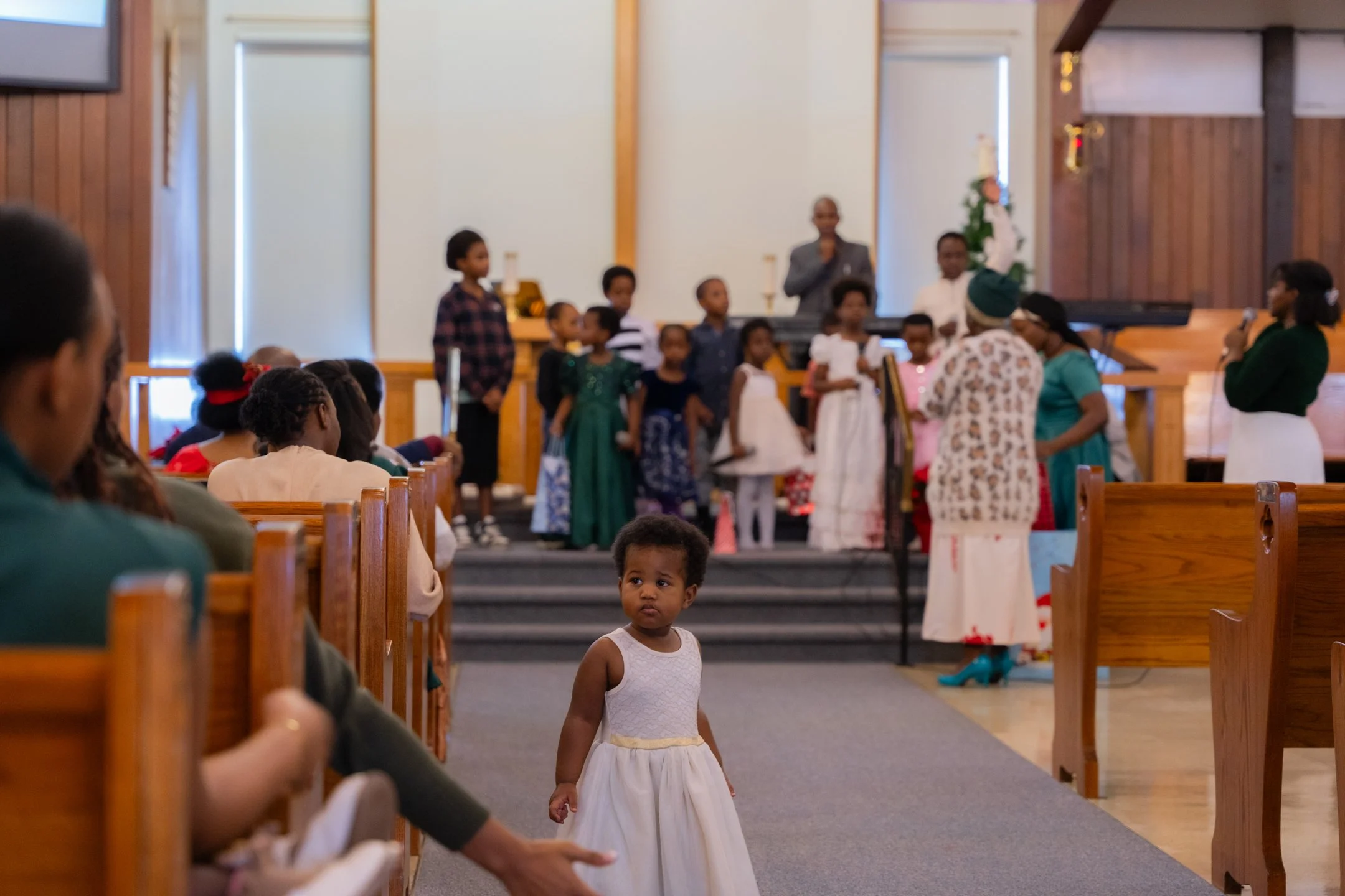 Children gathered at the front of the Carmel sanctuary